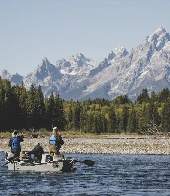 Anglers in a drift boat on the Snake River below the Grand Teton